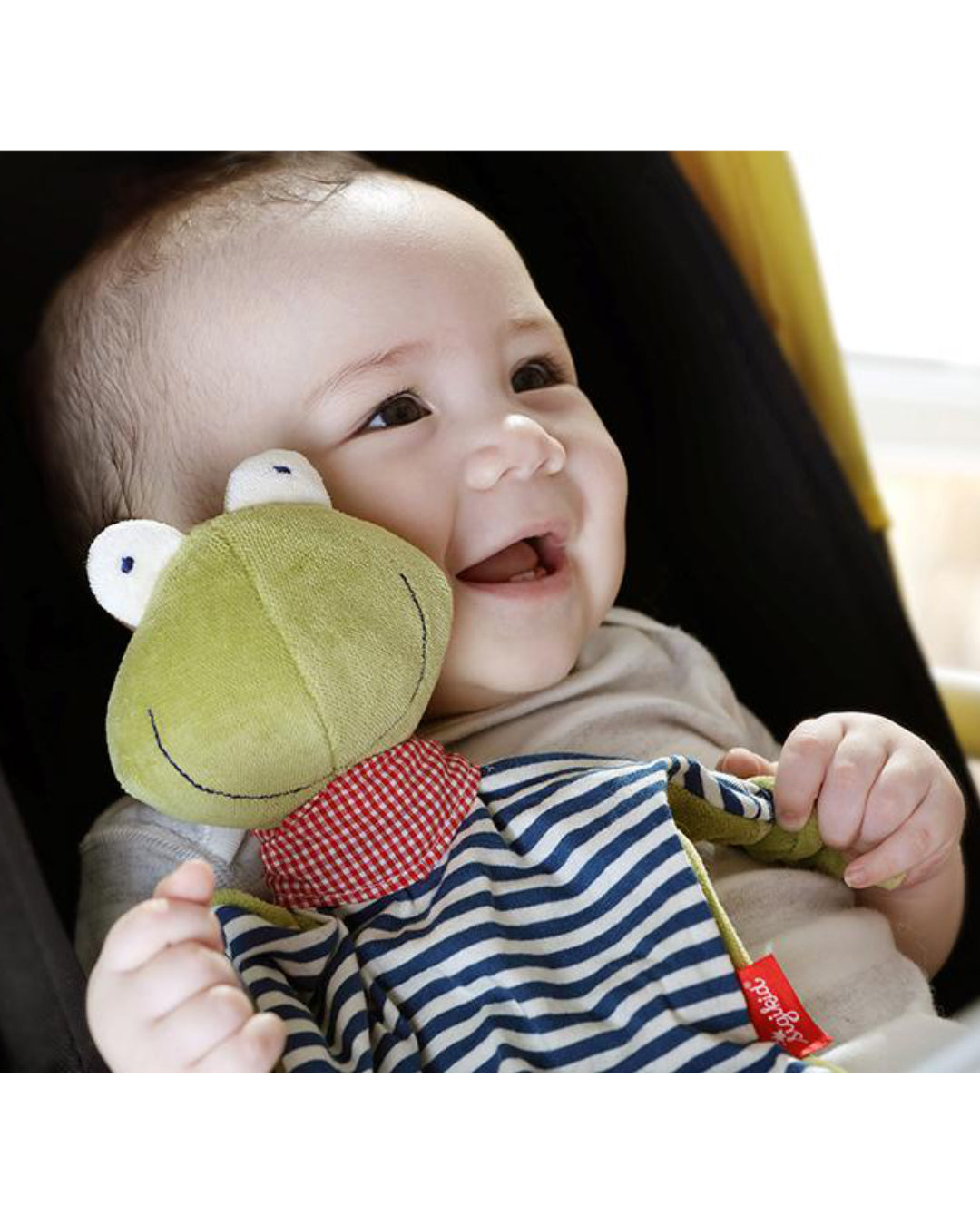 lachendes Baby mit Schnuffeltuch Frosch von sigikid