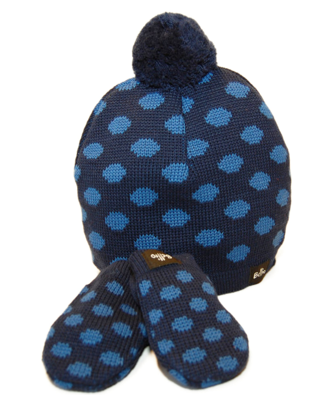 Dunkelblaue Bommelmütze und Handschuhe mit hellblauen Punkten aus Wolle für Babys